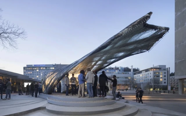 A pavilion based on moth webs made by drones and robots