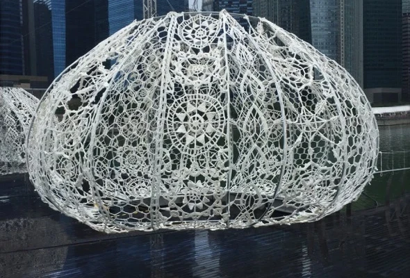 Crochet installations resembling sea urchins play with light