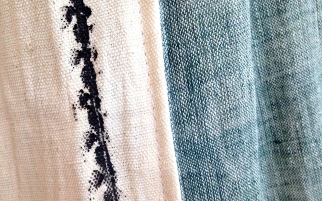 Hand-woven scarves printed with pollution