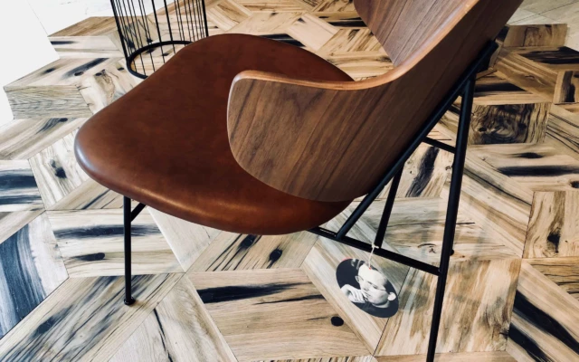 Circular floor tiles made out of railroad beams