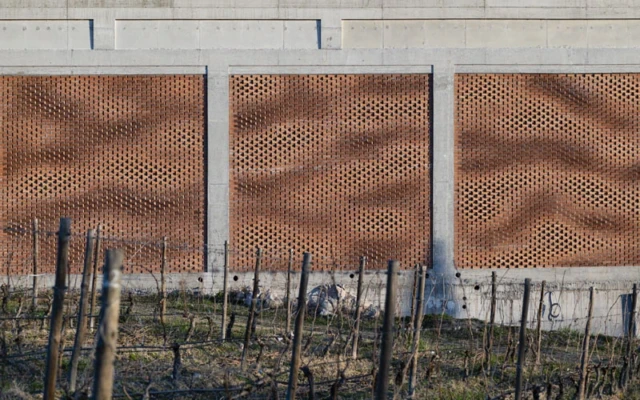 A semi-transparent brick façade made with augmented bricklaying