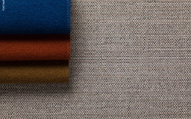 Tactile textiles in faced panels