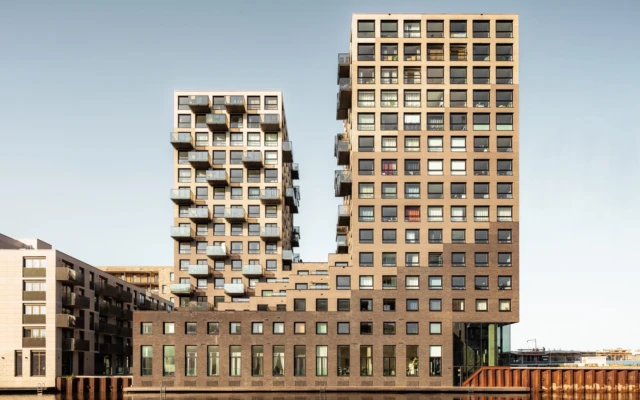 A high-rise building made of repurposed urban waste