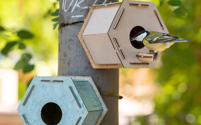 A birdhouse made of waste linoleum