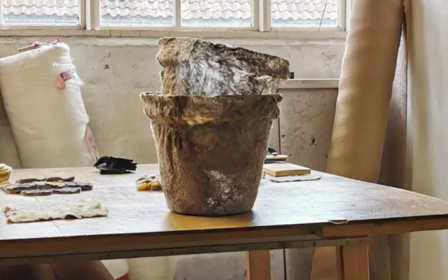 A compostable plant pot made of wool