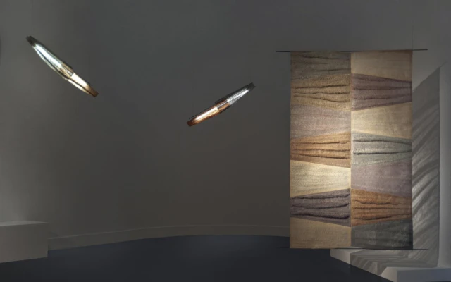 A pendant light and room divider made of luffa