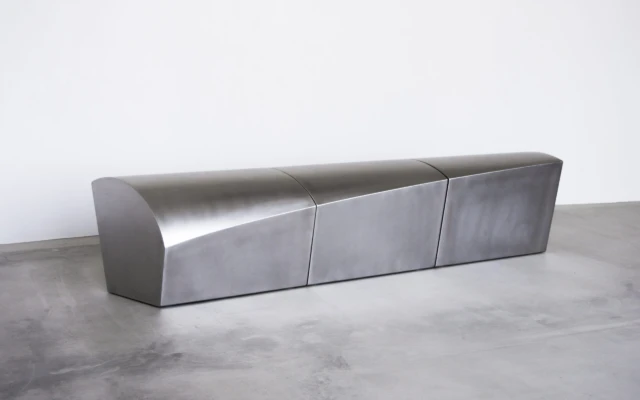Presence: A Sculptural Stainless Steel Bench Celebrating Human Warmth