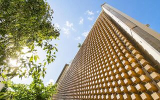 Modular Timber Façade Uses Variation To Shape Light And Shadow